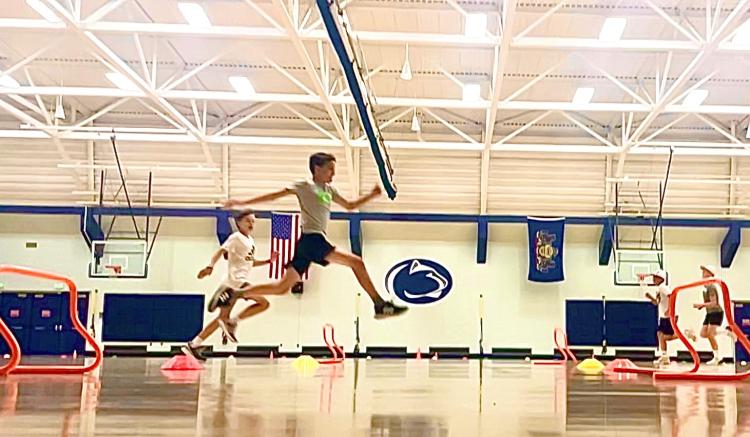 Campers participating in a variety of sport-related fitness and skill assessment